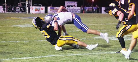 Justin Fitzgerald/Cherokee Scout Murphy’s Trenton Russell brings down Andrew Knuckolls of Fannin County, Ga., during a 21-14 win over the Rebels on Sept. 17. The Bulldogs’ defense was stout again Friday night against Cherokee.