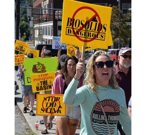 Glenn Harbison/The News Observer Protesters make their way up Grande Avenue toward City Hall in Copperhill, Tenn., on Oct. 4.