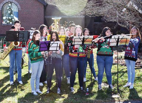 Bill Belian/Contributing Photographer  The Andrews High School Band entertained festival-goers during the 10th annual Christmas on Main on Nov. 18.