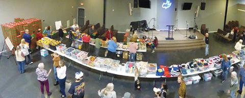 Barbara Cooper/Contributing Photographer Members of Calvary Chapel Church in Murphy gave their time, energy and gifts to prepare Christmas boxes that will be sent out to children around the world.