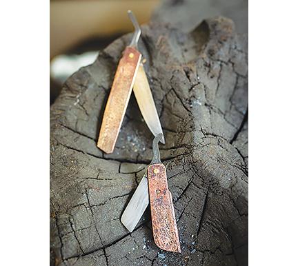 Jason Bivens (top photo) learned blacksmithing at a young age by making pocketknives (bottom photo).
