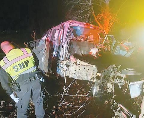 N.C. Highway Patrol Trooper Robertson investigates the mangled remains of a 2019 Ford F150 after it crashed Nov. 6 on Cherry Road in Hayesville.