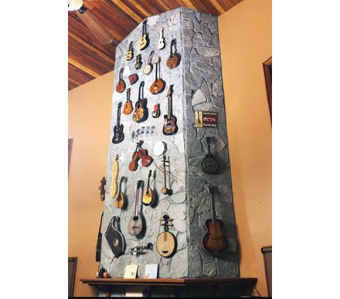 A 30-foot rock fireplace is adorned with musical treasures and memories from a life of music, friends and travel for local residents Jim and Marci Wilcox. Read their interesting profile in the Oct. 25 edition of the Cherokee Scout.