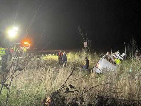 Randy Foster/editor@cherokeescout.com Workers prepare to remove wreckage of a utility pole truck involved in a two-vehicle collision at the entrance to the Cherokee County solid waste disposal site on Dec. 4 Eastbound lanes were blocked and traffic was detoured during the recovery operation.