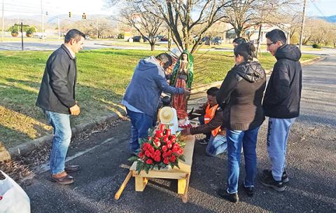 Photos by Nicole Wright/Staff Correspondent Parishioners from Holy Redeemer Catholic Church in Andrews get ready for the Our Lady of Guadalupe Procession, which is held every Dec. 12 here and around the world.