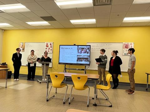 Tri-County Early College student leaders make a presentation to a regional meeting of early college principals and representatives of the N.C. Department of Public Instruction. The students shared information and personal experiences about what makes them successful at the Peachtree high school.