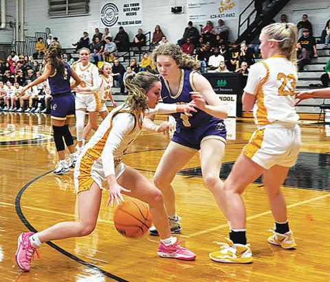 Photos by J.R. Carroll/Staff Correspondent Cayla Geer dribbles to get into scoring positon after a pick. 