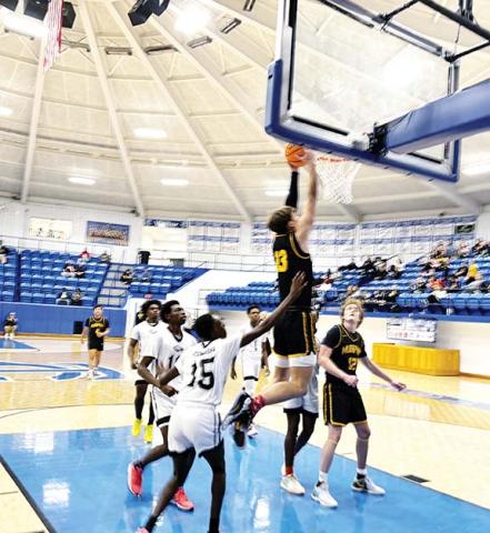 J.R. Carroll/Staff Correspondent Zach Skogen goes up for the flush during the Battle of the State Tournament last week.