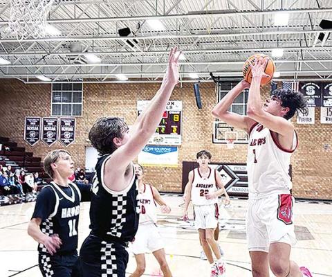 J.R. Carroll/Staff Correspondent Andrews’ Cam Rattler goes up for two points during the Swain County Christmas Tournament last week. The Wildcats’ boys team won both of their games.