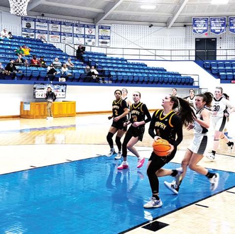 J.R. Carroll/Staff Correspondent Saige Kent drives into the paint for a Murphy score during last week’s Battle of the States Tournament.