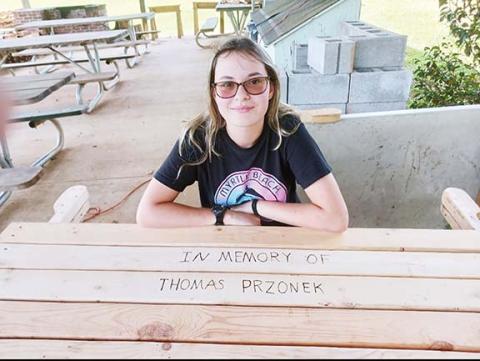Martins Creek School student Abby Farner was happy to inscribe a message on the table using a wood-burning tool.