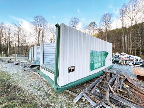 Randy Foster/editor@cherokeescout.com This metal building belonging to Rhodo Mini Storage in the Granny Squirrel area of eastern Cherokee County was toppled by high winds during storms over the weekend.