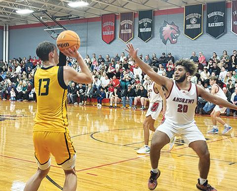 Photos by J.R. Carroll/Staff Correspondent Murphy’s Zach Skogen shoots while being covered by Landon Green of Andrews on Jan. 5