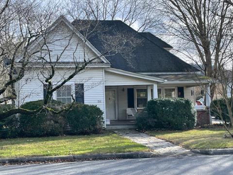 The home of Luther and Olive Ellis is on Main Street in Andrews, beside the P.B. Ferebee Home. Their son, John Luther Ellis, married Hazel Burgess, and they had three children, John Eric (Rick), Joel Tatham Ellis and Elaine. The children have many wonderful memories growing up with their grandparents. The grandson, John Eric (Rick), lives in the house today. 