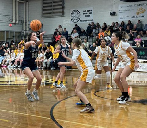 J.R. Carroll/Staff Correspondent Zoey Passmore of Nantahala passes to a teammate on Jan. 9 against Murphy.