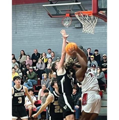 Jeff Tathum/Contributing Photographer Gabe Clark gets into scoring position in the paint for Andrews.
