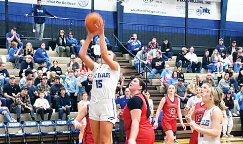 J.R. Carroll/Staff Correspondent Junior Olivia McNabb sinks the shot that gave her 1,000 career points for the Hiwassee Dam Lady Eagles’ basketball team on Jan. 23 at “The Nest.”