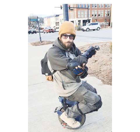 Anngee Quinones-Belian/ Staff Correspondent Matthew Longwell of Hanging Dog enjoys moving about on his electric unicycle, which he claims is street legal.