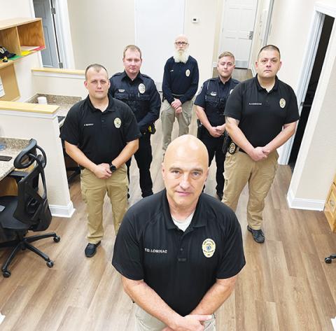 Randy Foster/editor@cherokeescout.com Murphy Police Chief Tim Lominac (front) stands with some members of his department Friday. Starting left and going clockwise are Investigator Jason Murphy, Officer Cody Williams, administrative assistant Jon Avery, Patrol Officer Parker Southard and Assistant Chief Ryan Cunningham. Not pictured are Sgt. Adam May, Cpl. Hunter Sanders, Officer Caleb Allen, and Basic Law Enforcement Training students Sara Taylor and Brayden Snow.