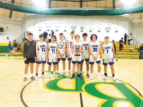 Photos by April McNabb/Contributing Photographer The Hiwassee Dam boys varsity basketball team with the Eagles’ Little Smoky Mountain Conference championship trophy. From left are Isiah Crisp, Braiden Ledford, Kyle Taylor, Jonah Hamby, Dawson Headley, Cameron Dills, Aiden Bennett, Clay Davis and Jack Raper.