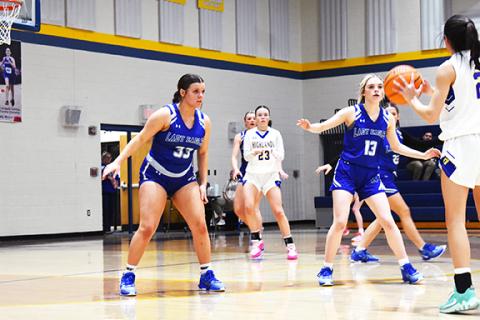 April McNabb/Contributing Photographer Sky Taylor (left) and Brooklyn Hyde (right) defend against Highlands on Feb. 6.