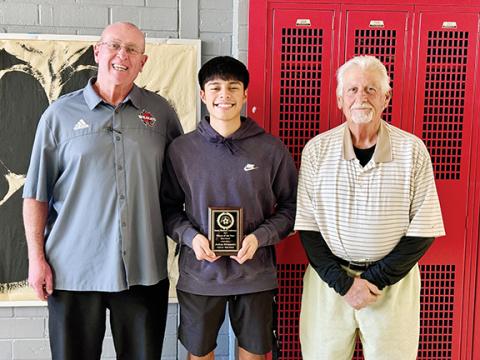 J.R. Carroll/Staff Correspondent From left are Andrews athletic director Frank Maenlee, Smoky Mountain Conference Soccer Player of the Year Joshua Hernandez and Andrews soccer coach Patrick Santon.
