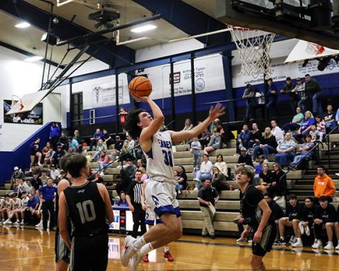 Cannon Crompton/sports@cherokeescout.com Eagles shooting guard Clay Davis goes up for a layup against Robbinsville on Thursday.