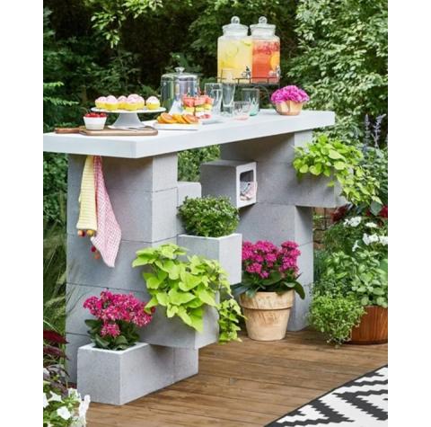 Old or unused cinder blocks can be positioned together to create furniture, a backyard work-station for gardening, an outdoor fireplace or a sturdy grill.