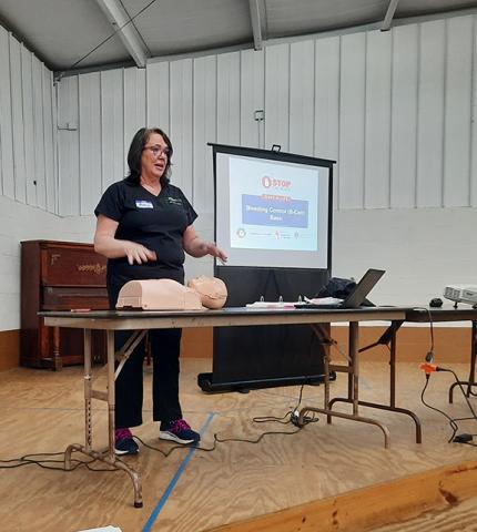 Photos by Anngee Quinones-Belian/Staff Correspondent  Instructor Amy Nance Nelson, a registered nurse, taught folks CPR and techniques on how to stop serious bleeding at the Peachtree Community Center on Saturday morning.