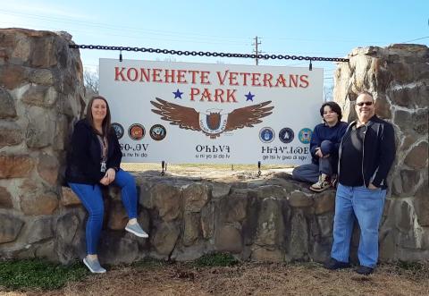 Anngee Quinones-Belian/Staff Correspondent  Sign of the good times: Danna Pash and Richard Millett with Cherokee County Veterans Services celebrate Abigail McKnight’s winning contest design for the recently renamed Konehete Veterans Park off of Valley River Avenue in Murphy.