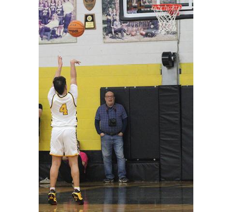J.R. Carroll/Staff Correspondent Xander Wachacha shoots free throws in overtime Friday.