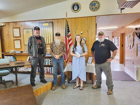 Nicole Wright/Staff Correspondent Andrews Veterans of Foreign Wars Post 7620 recently awarded its annual $1,000 scholarship to Carley Clark of Andrews High School. From left are Keith Welch, Scott Ramler, Clark and Mark Dockery.