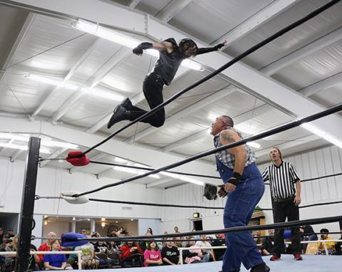 Photos by Cannon Crompton/sports@cherokeescout.com Digger James jumper off the top turnbuckle to slam Mountain Man Jeremy Stiles.