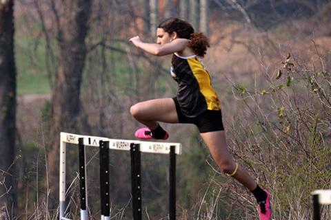 J.R. Carroll/Staff Correspondent Murphy’s Ivy Warner on her way to winning the 100-meter hurdles on March 20.