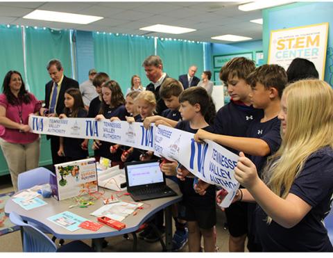 J.R. Carroll/Staff Correspondent Students in Cicely Cable’s STEM Center class at Murphy Elementary School cut the ribbon on April 24 as Cherokee County Board of Education Chair Shannon Raper (far left) and Superintendent Keevin Woody (to her right) look on.