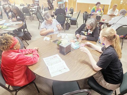 Nicole Wright/Staff Correspondent Beading jewelry during the Learning Leisure Skills session at the annual Multicultural Women’s Development Conference, sponsored by One Dozen Who Care Inc. last weekend at Hinton Life Center in Hayesville. From left are Glynette Scott, Patricia Hall, Emory Prescott and Hannah Larson.