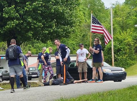 Nicole Wright/Staff Correspondent The 22-Humpers take a final break at the Hiwassee Street Boat Ramp on Saturday at Warriors Veteran Outreach’s 10th annual event to raise awareness for veterans’ suicides.