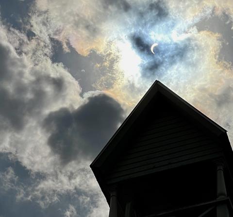 Randy Foster/editor@cherokeescout.com The solar eclipse as seen above Episcopal Church of the Messiah in downtown Murphy on Monday afternoon.