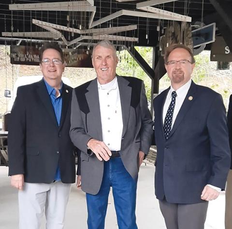 Anngee Quinones-Belian/Staff Correspondent Roger Swanson received the Purple Heart for his military service that resulted in injury in 1969 at Band of Brothers Veteran Park in Murphy on Friday. From left are state Sen. Kevin Corbin (R-Franklin), Swanson and U.S. Rep. Chuck Edwards (R-N.C.).