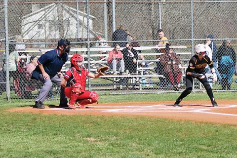 J.R. Carroll/Staff Correspondent Andrews catcher Hannah Talkington (left) awaits a pitch as Emma Hensley (right) bats Thursday.