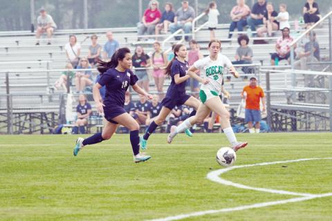 Photos by Cannon Crompton sports@cherokeescout.com: Tri-County’s Jasmine Tran runs with the ball past defenders in her two-goal game on April 15