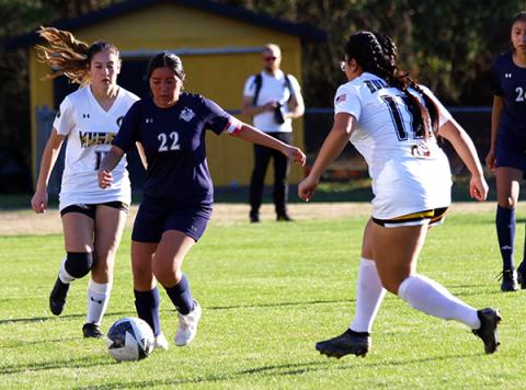 Cannon Crompton/sports@cherokeescout.com Tri-County’s Iris Diaz-Menchu runs past defenders in their match against Murphy on March 11.