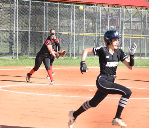 Kevin Hensley/Graham Star Kinleigh Queen makes a throw to first base in their game against Robbinsville on April 5.