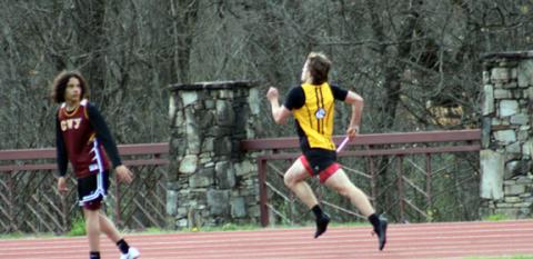 J.R. Carroll/Staff Correspondent Brady Grant of Murphy says, “I’m already gone,” while taking the relay on March 27.