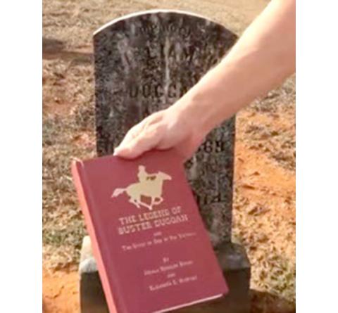 Buster Duggan’s exploits are documented in a book The Legend of Buster Duggan, co-authored by the nephew of John Moses, one of Duggan’s victims. The book is being held in front of Duggan’s tombstone in Monroe County.