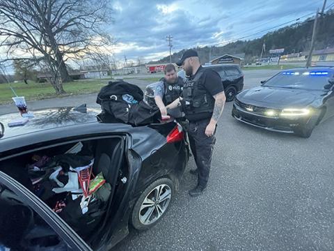 Randy Foster/editor@cherokeescout.com Andrews police officers Caleb White (left) and Bradley Bowen search a car driven by Jennifer McCullough on March 25 near Andrews Town Hall.