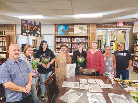 Nicole Wright/Staff Correspondent  From left are staff member Jeff Murphy; Greta Whisonant, artist; Bailey Shope, artist; branch co-manager Kelly Bryant; Jacob Teasdale, artist; branch co-manager Jacqueline Hulse; and Friends of the Andrews Public Library members Barbara El-Khouri and Clifford Panter.