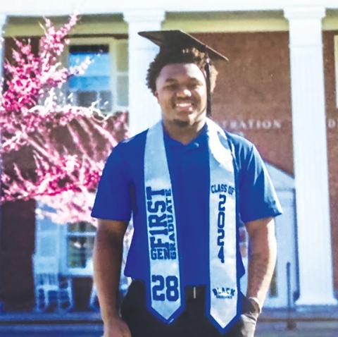 J.R. Carroll/Staff Correspondent  Murphy graduate Devonte Smith stands in front of the administration building at Brevard College.