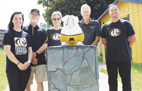 J.R. Carroll/Staff Correspondent The Watson coaching family includes (from left) Nikol Watson Edwards, Flip Watson, Karen Watson, Wayne Watson and Joseph Watson, shown with the Murphy Bulldog.    