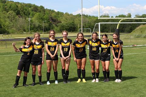 Cannon Crompton/sports@cherokeescout.com The Murphy Middle School soccer team celebrated Eighth-grade Night with a 5-1 win over Rabun Gap-Nacoochee, Ga., on May 2. Before the game, the team’s eighth-graders were honored. From left are Olivia Potter, Elizabeth Nave, Emma Elliott, Riley Johnston, Abby Lovingood, Deserae Zenobi, Ella Ledford and Addison Peterson.